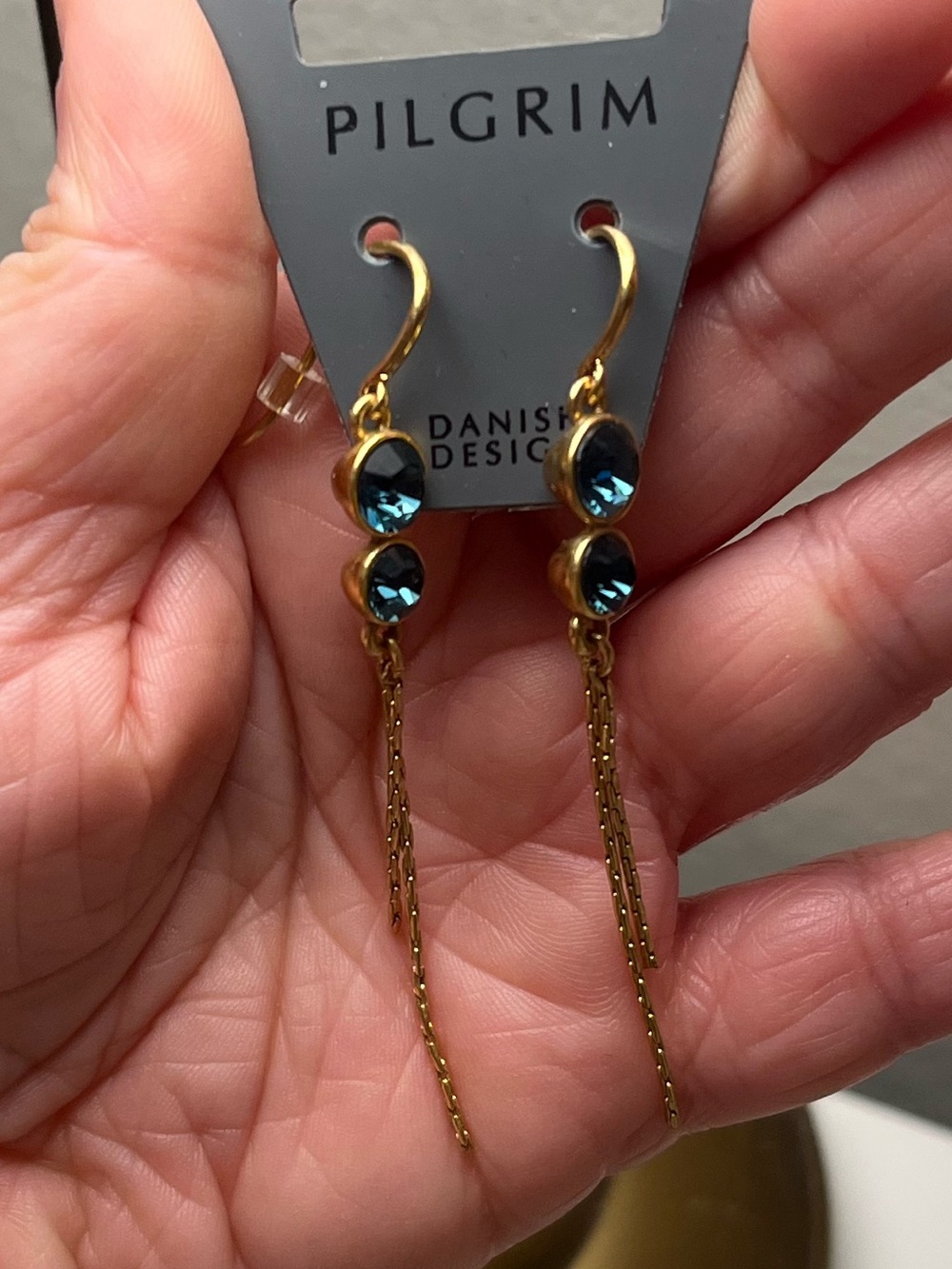 Pilgrim Gold Tone Drop Earrings with Teal Blue Stones and Chain Tassels